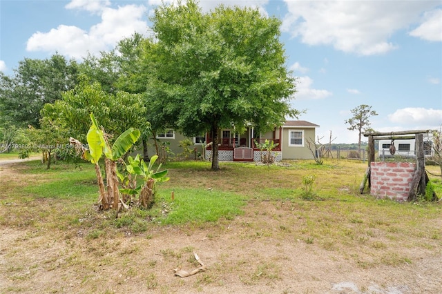 260 Taft Blvd, Clewiston, FL 33440 - view of grassy yard featuring a wooden deck