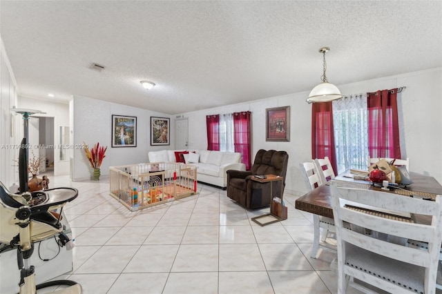 260 Taft Blvd, Clewiston, FL 33440 - living room with a textured ceiling and light tile patterned floors