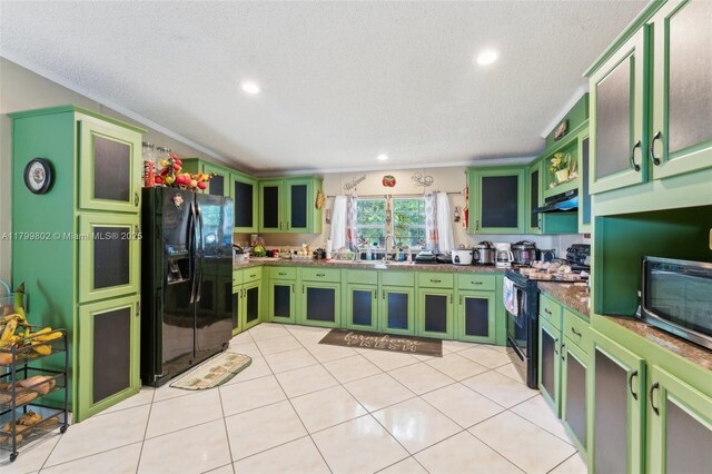 260 Taft Blvd, Clewiston, FL 33440 - kitchen with green cabinets, black fridge with ice dispenser, range with electric stovetop, a textured ceiling, and recessed lighting