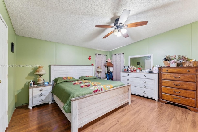 260 Taft Blvd, Clewiston, FL 33440 - bedroom with vaulted ceiling, wood finished floors, a textured ceiling, and ceiling fan