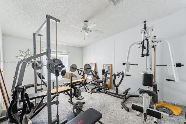 260 Taft Blvd, Clewiston, FL 33440 - workout room featuring a textured ceiling, a ceiling fan, and carpet flooring
