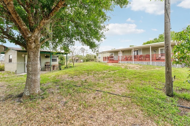 260 Taft Blvd, Clewiston, FL 33440 - view of green lawn with a deck