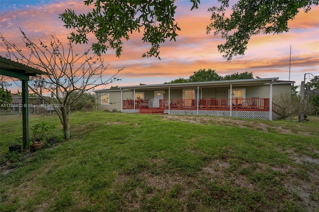 260 Taft Blvd, Clewiston, FL 33440 - rear view of property featuring a yard and covered porch