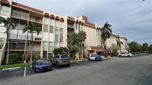 2101 Atlantic Shores Blvd Unit 415, Hallandale Beach, FL 33009 - view of building exterior featuring uncovered parking