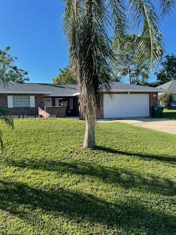1431 Felton St, Deltona, FL 32725 - single story home featuring concrete driveway, a front lawn, and an attached garage