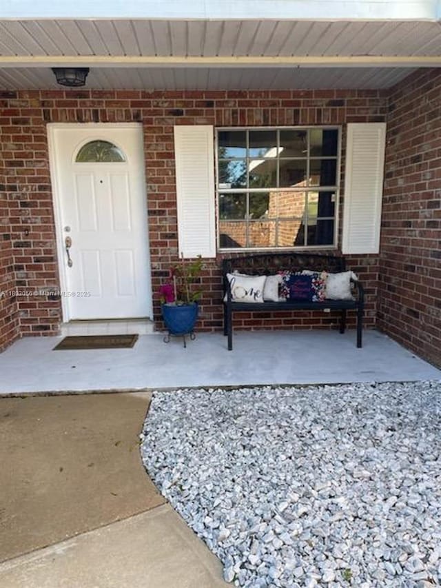 1431 Felton St, Deltona, FL 32725 - property entrance with a porch and brick siding