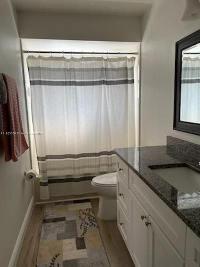 1431 Felton St, Deltona, FL 32725 - full bathroom with toilet, vanity, wood finished floors, and a shower with shower curtain