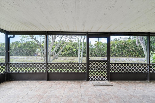 unfurnished sunroom featuring plenty of natural light