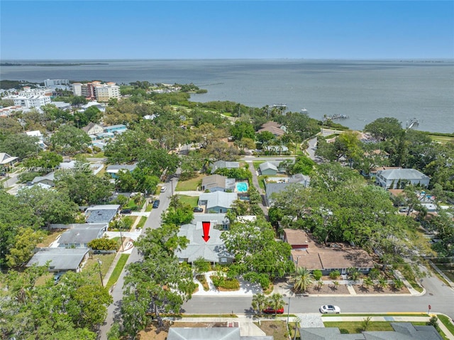view of property location with a nearby body of water and nearby suburban area