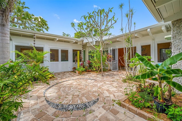 back of property with a patio area