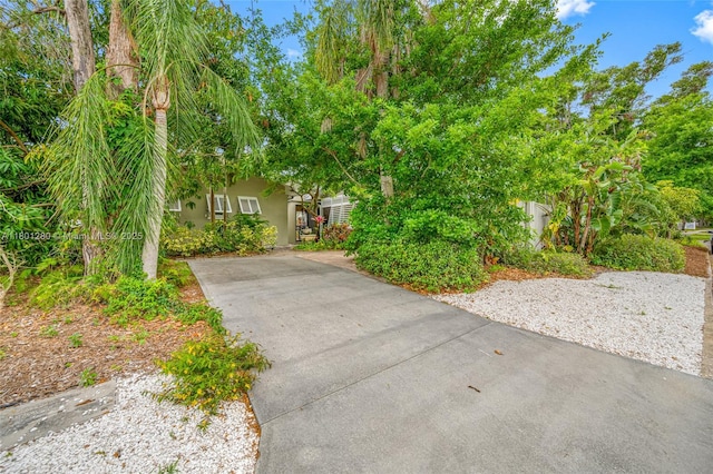 view of front of property with concrete driveway and stucco siding