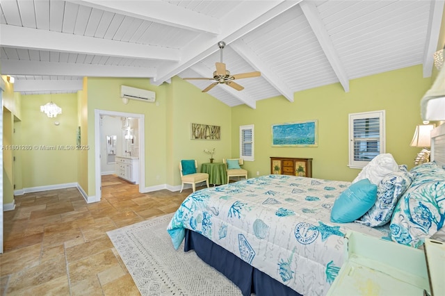 bedroom with stone tile flooring, a wall unit AC, baseboards, a ceiling fan, and ensuite bath