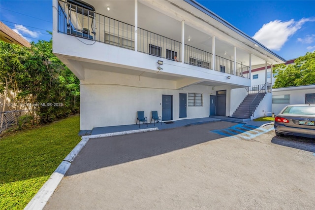 2414 Johnson St, Hollywood, FL 33020 - view of property featuring stairs and fence