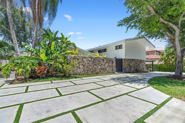 view of patio with concrete driveway