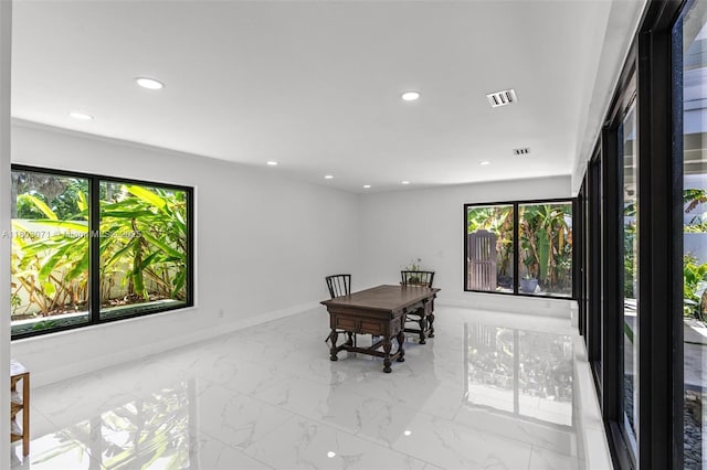 dining area with healthy amount of natural light, recessed lighting, marble finish floors, and baseboards