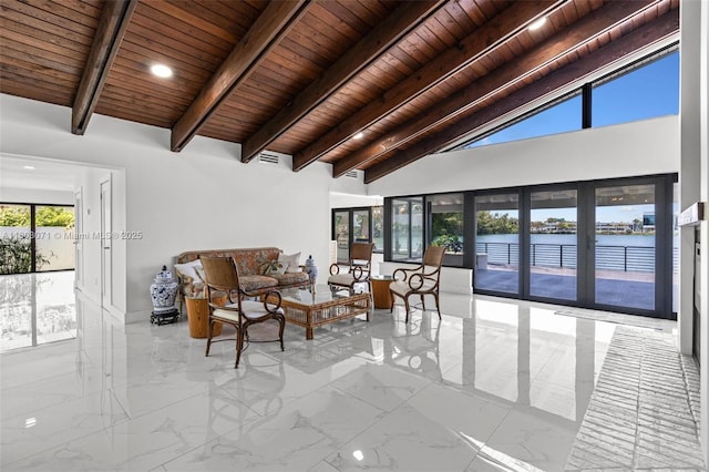 lobby featuring wood ceiling, beamed ceiling, a water view, recessed lighting, and high vaulted ceiling