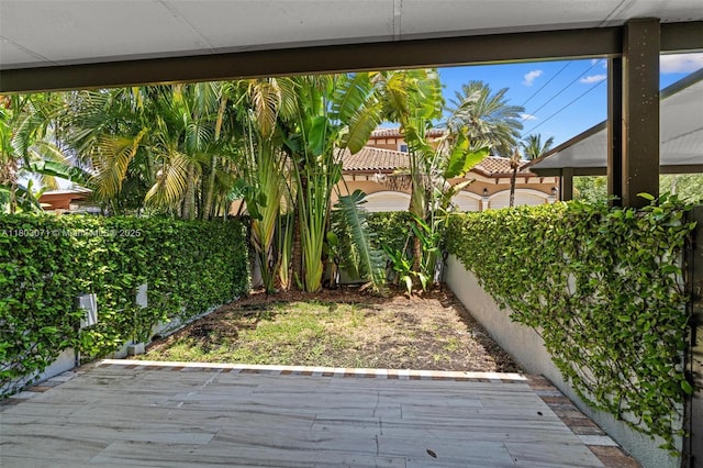 fenced backyard with a wooden deck