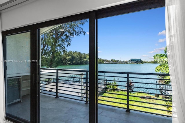 balcony featuring a water view