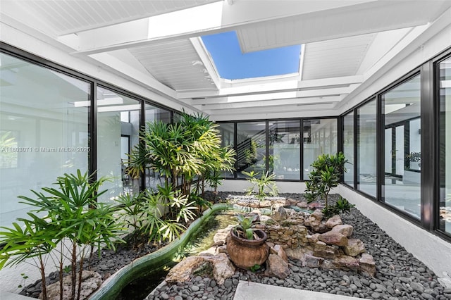 sunroom featuring a skylight