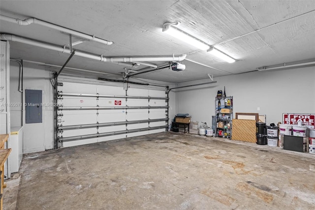 garage with electric panel and a garage door opener