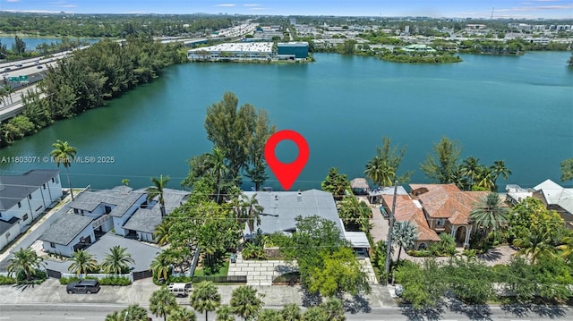 aerial perspective of suburban area featuring a nearby body of water
