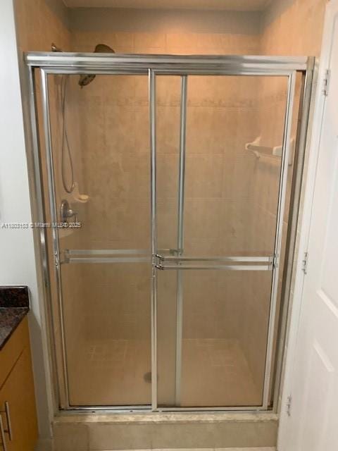 4907 Midtown Ln Unit 1113, Palm Beach Gardens, FL 33418 - bathroom featuring a stall shower and vanity