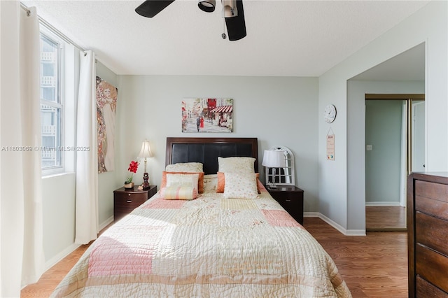 4330 Hillcrest Dr Unit 505, Hollywood, FL 33021 - bedroom with wood finished floors, baseboards, and a ceiling fan