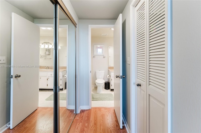 4330 Hillcrest Dr Unit 505, Hollywood, FL 33021 - hall featuring light wood-style floors and a sink