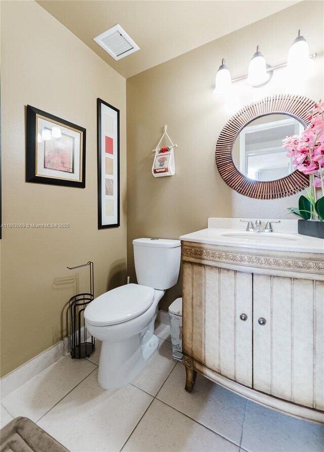 4330 Hillcrest Dr Unit 505, Hollywood, FL 33021 - half bathroom with toilet, tile patterned flooring, vanity, and baseboards