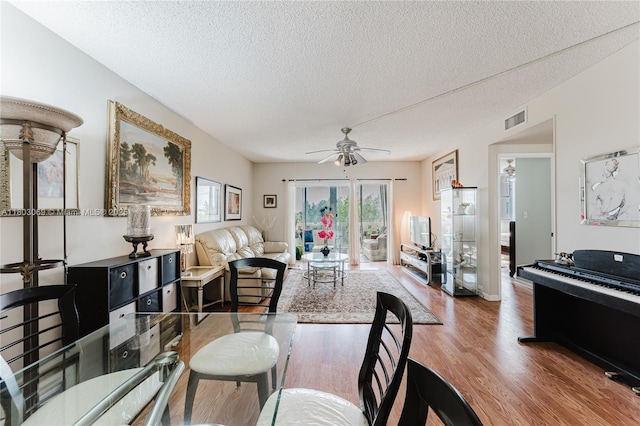 4330 Hillcrest Dr Unit 505, Hollywood, FL 33021 - living area with wood finished floors, a ceiling fan, and a textured ceiling