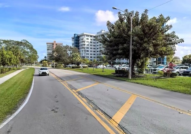 4330 Hillcrest Dr Unit 505, Hollywood, FL 33021 - view of asphalt road with street lighting