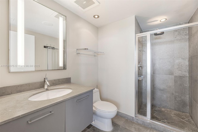 450 Alton Rd Unit 2303, Miami Beach, FL 33139 - bathroom with toilet, a stall shower, vanity, tile patterned floors, and recessed lighting