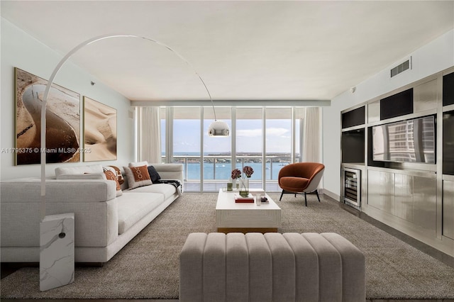 450 Alton Rd Unit 2303, Miami Beach, FL 33139 - living area with a water view, floor to ceiling windows, and plenty of natural light