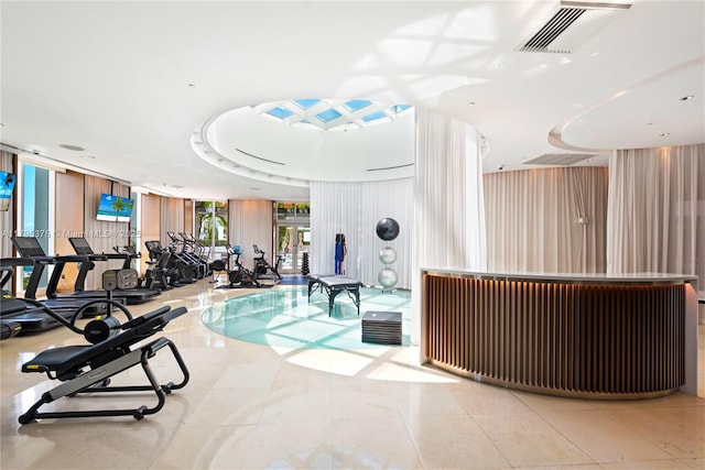450 Alton Rd Unit 2303, Miami Beach, FL 33139 - exercise room featuring a wall of windows and tile patterned floors