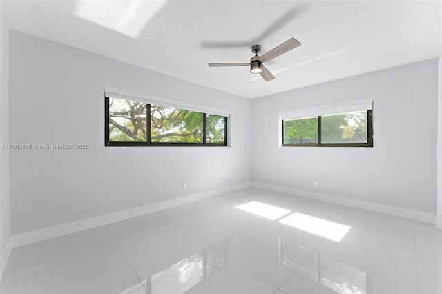 1998 NE 180th St, North Miami Beach, FL 33162 - spare room with baseboards, ceiling fan, and light tile patterned floors