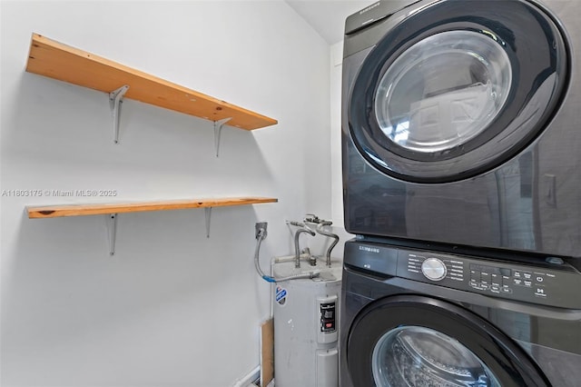 1998 NE 180th St, North Miami Beach, FL 33162 - laundry room featuring stacked washing machine and dryer and electric water heater