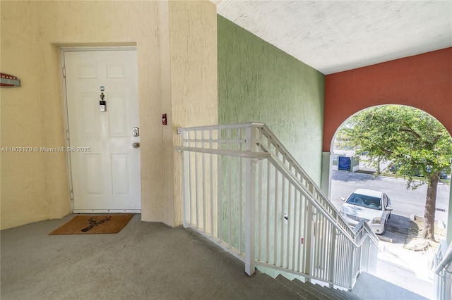 property entrance featuring stucco siding
