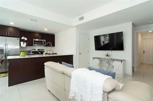 13949 SW 259th Way, Homestead, FL 33032 - living room featuring light tile patterned flooring, recessed lighting, and baseboards