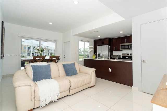 13949 SW 259th Way, Homestead, FL 33032 - living room with recessed lighting and light tile patterned flooring