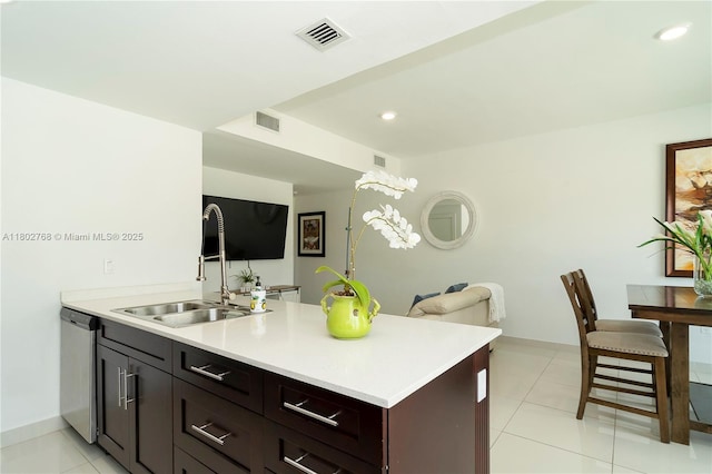 13949 SW 259th Way, Homestead, FL 33032 - kitchen with a sink, a peninsula, stainless steel dishwasher, light countertops, and baseboards