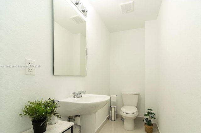 13949 SW 259th Way, Homestead, FL 33032 - bathroom with toilet, baseboards, and tile patterned floors