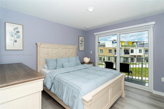 13949 SW 259th Way, Homestead, FL 33032 - bedroom with light wood-style floors, access to outside, and baseboards