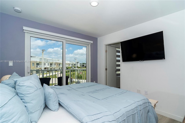 13949 SW 259th Way, Homestead, FL 33032 - bedroom featuring access to exterior, baseboards, and wood finished floors