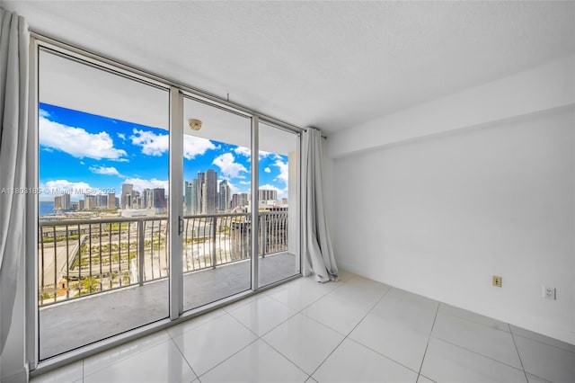 1750 N Bayshore Dr Unit 3308, Miami, FL 33132 - spare room featuring a view of skyline, floor to ceiling windows, plenty of natural light, and a textured ceiling