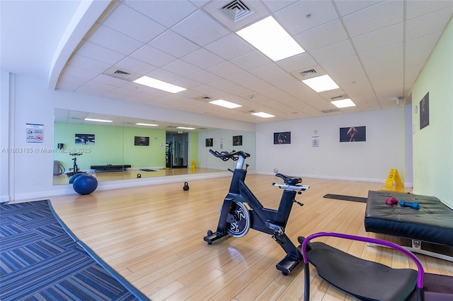 1750 N Bayshore Dr Unit 3308, Miami, FL 33132 - workout room featuring wood finished floors, a paneled ceiling, and baseboards