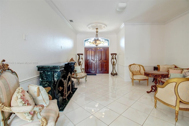 9072 NW 145th St, Miami Lakes, FL 33018 - foyer with crown molding, light tile patterned floors, and a chandelier
