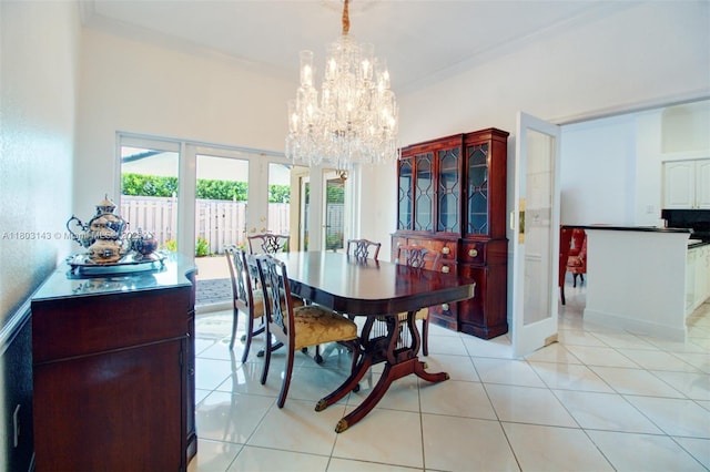 9072 NW 145th St, Miami Lakes, FL 33018 - dining room with a chandelier, ornamental molding, french doors, and light tile patterned flooring