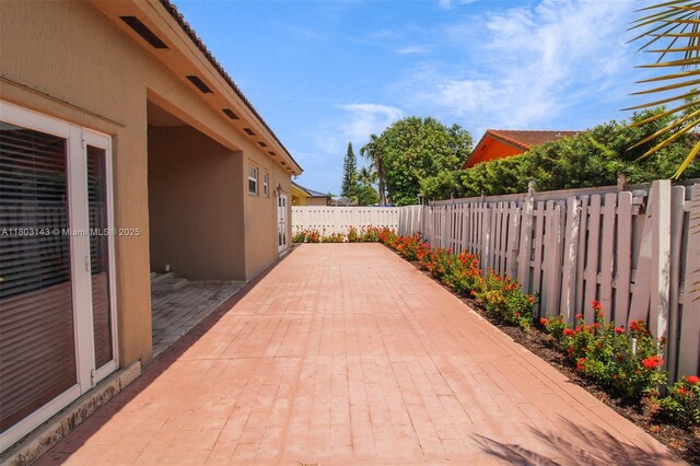 9072 NW 145th St, Miami Lakes, FL 33018 - fenced backyard featuring a patio