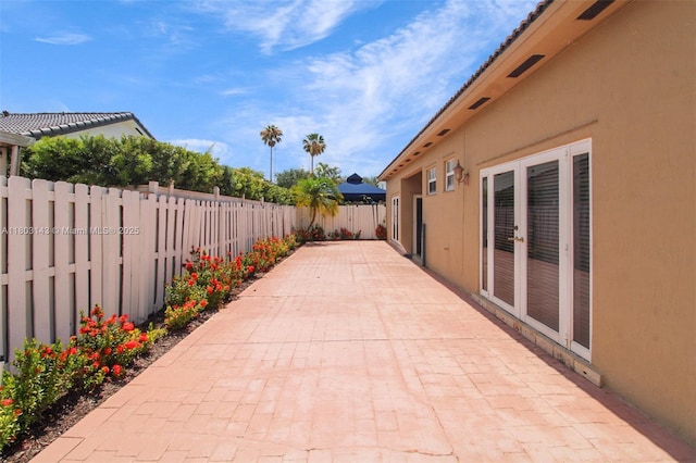 9072 NW 145th St, Miami Lakes, FL 33018 - fenced backyard featuring a patio area and french doors