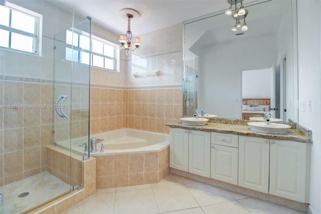 9072 NW 145th St, Miami Lakes, FL 33018 - full bath featuring a bath, a shower stall, double vanity, tile patterned flooring, and a chandelier